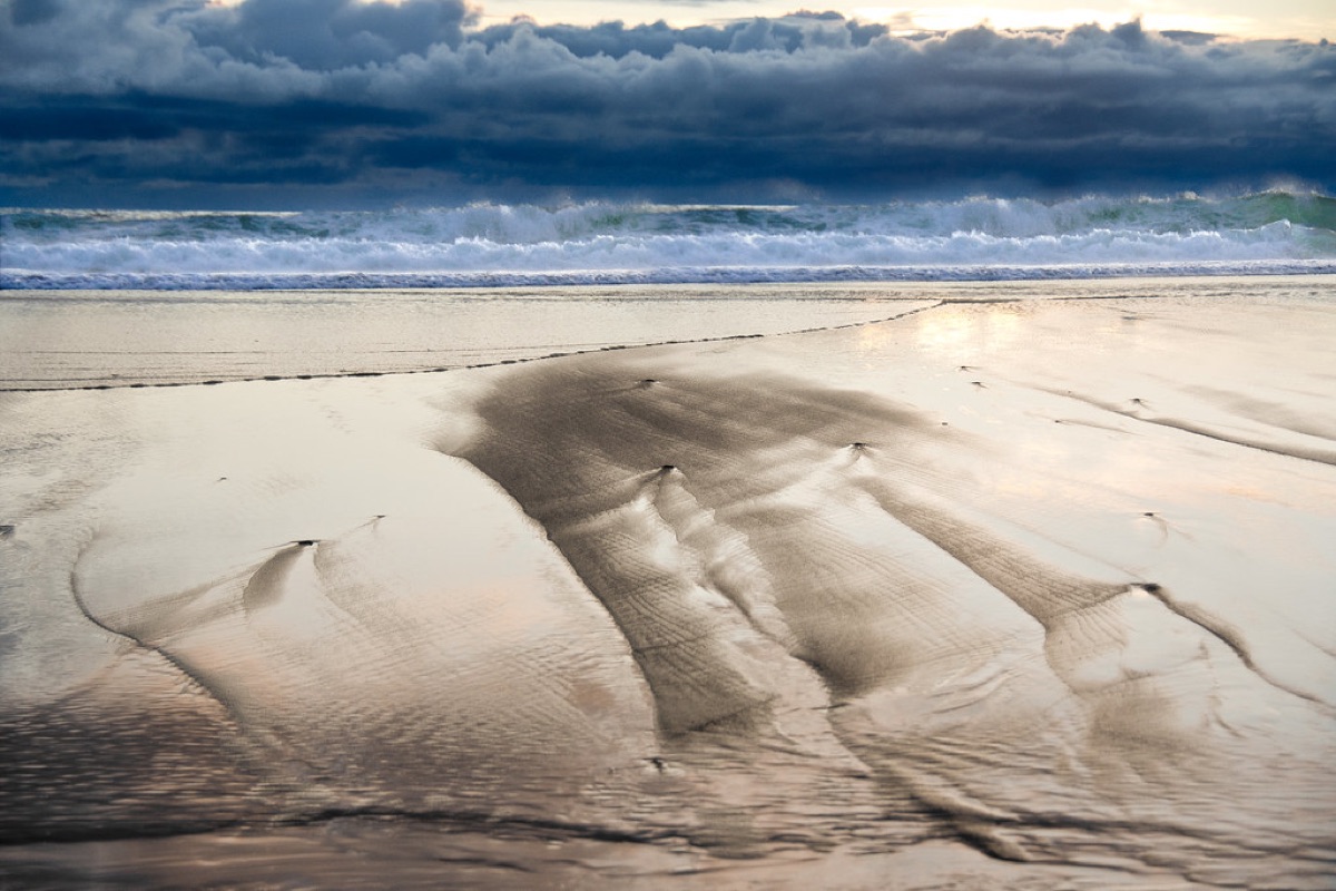 Calm water surface showing gentle, concentric ripples, representing focused listening.