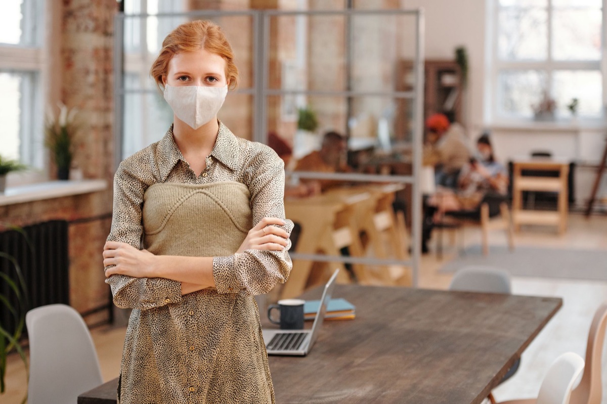 Woman in office with folded hands