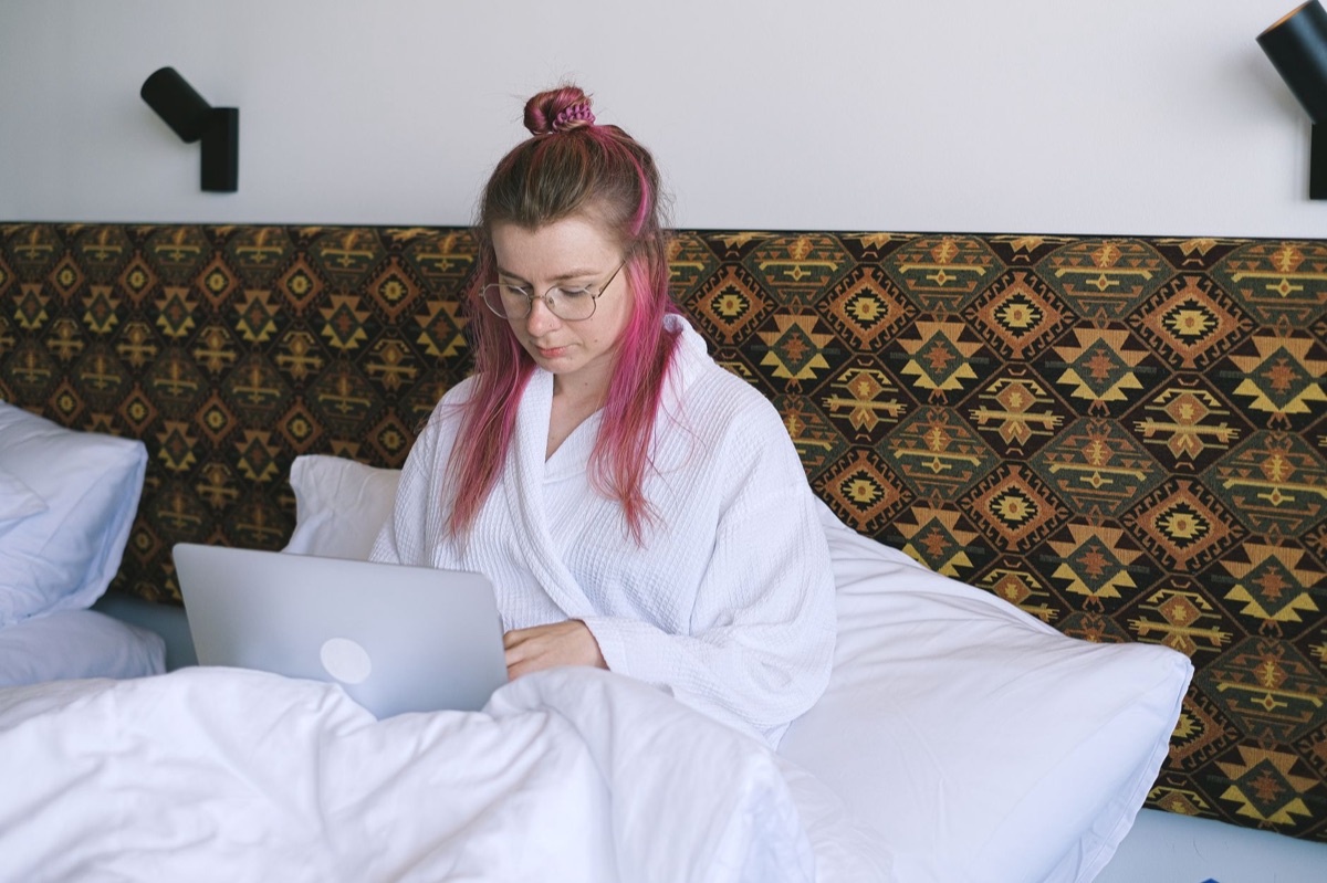 bedroom with laptop and robe